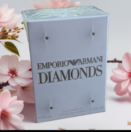 Emporio Armani Diamonds Damen Eau de Parfum 50ml Vorderansicht Verpackung mit rosa Blüten Hintergrund